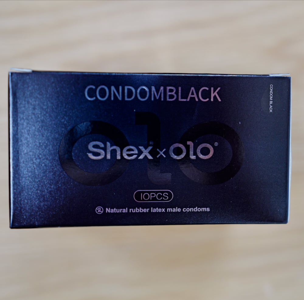 Shex x OLO retail box, 10 pieces, on a wooden table