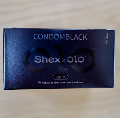 Shex x OLO retail box, 10 pieces, on a wooden table
