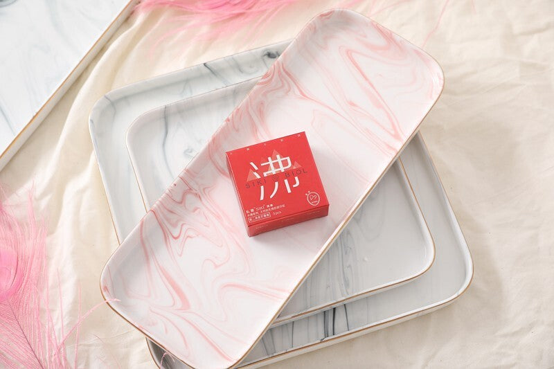 SIKI 003 red retail box on a marble tray