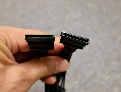 Hand holding the SATA connectors of the EVGA cable