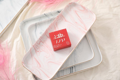 SIKI 003 red retail box on a marble tray