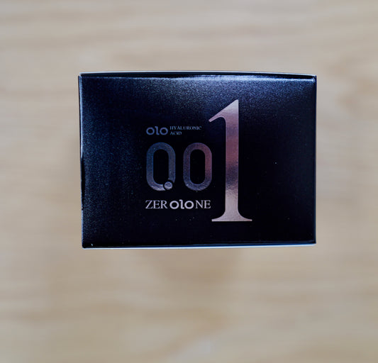 OLO ZEROLONE 001 Black retail box front on a wooden table