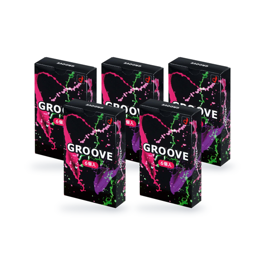 Five Okamoto Groove retail boxes in black Japanese packaging with a color splash design and a pink label marked 6 pieces, two rows, angled view