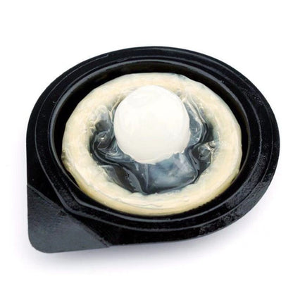 Opened condom wrapper showing a rolled condom